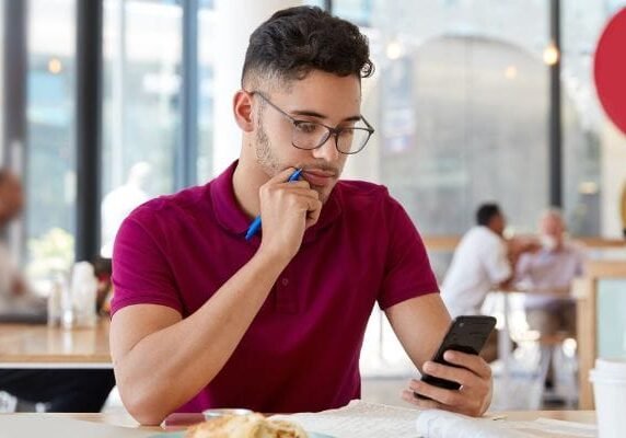 confused customer looking at phone